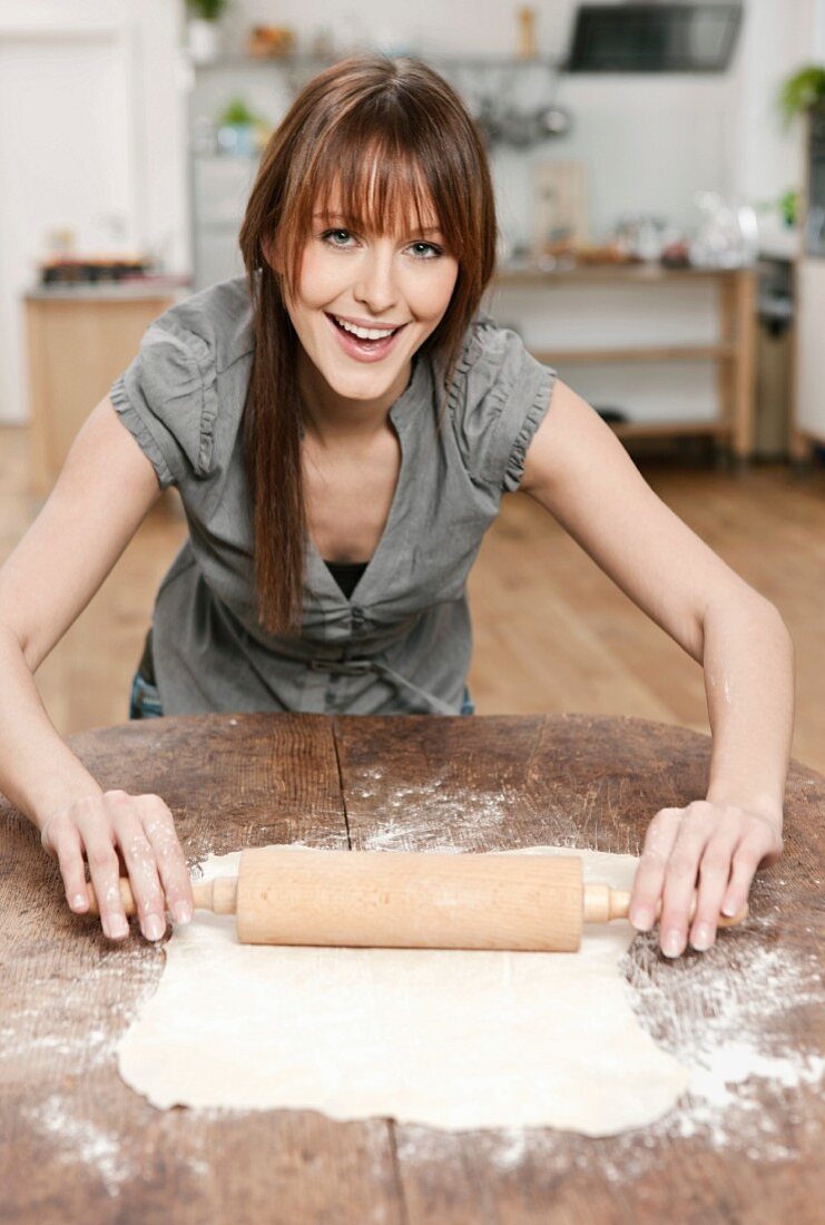 Woman rolling out pastry