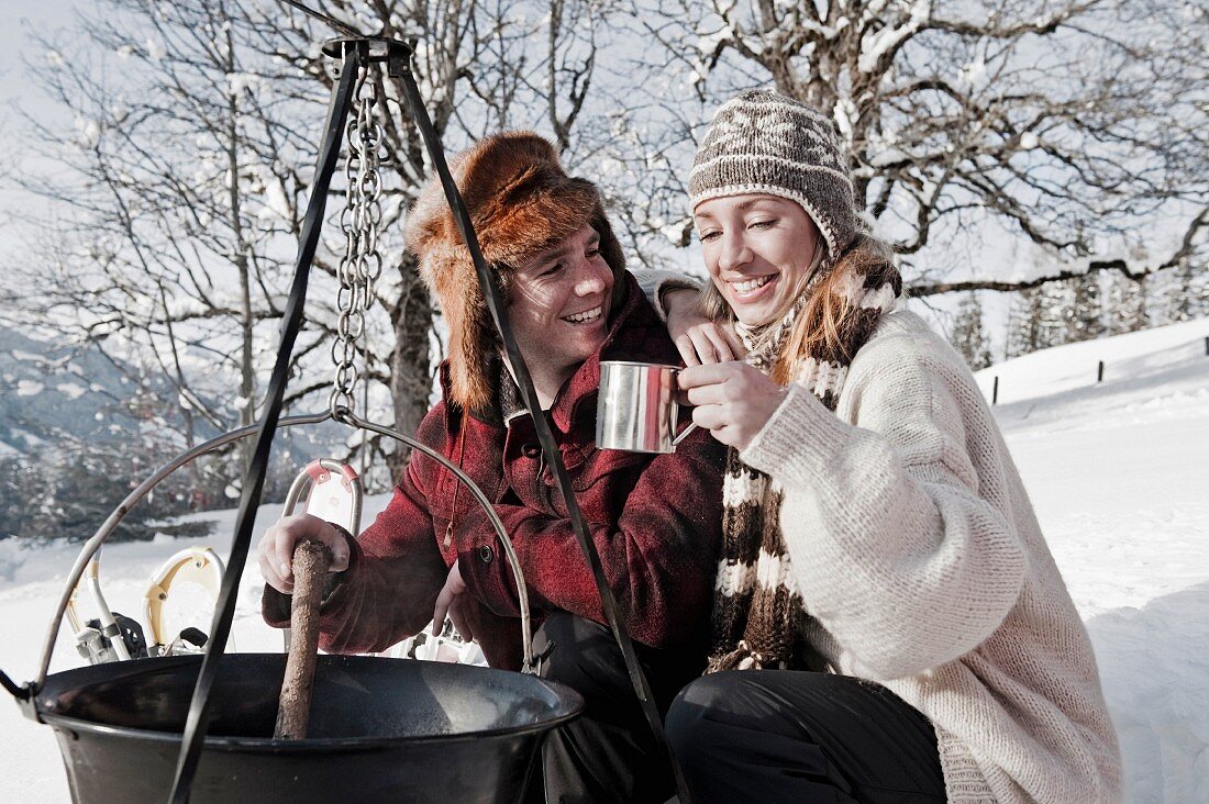 A couple camping in winter