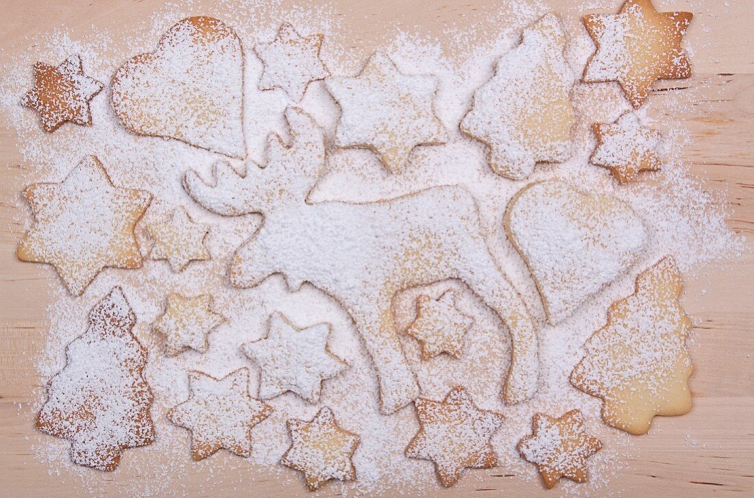 Various Christmas biscuits dusted with icing sugar