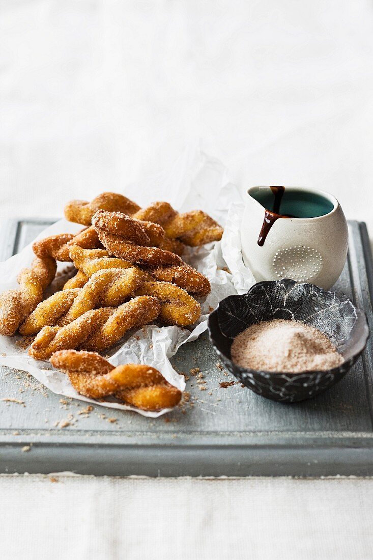 Vetkoek (fried South African cakes) with cinnamon sugar and chocolate sauce