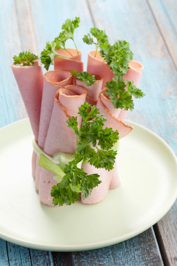 Rolled slices of meatloaf with parsley