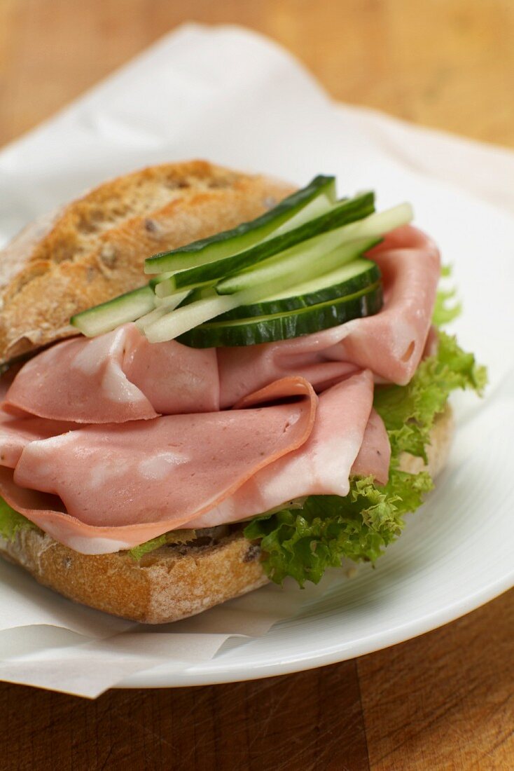 A mortadella and cucumber sandwich