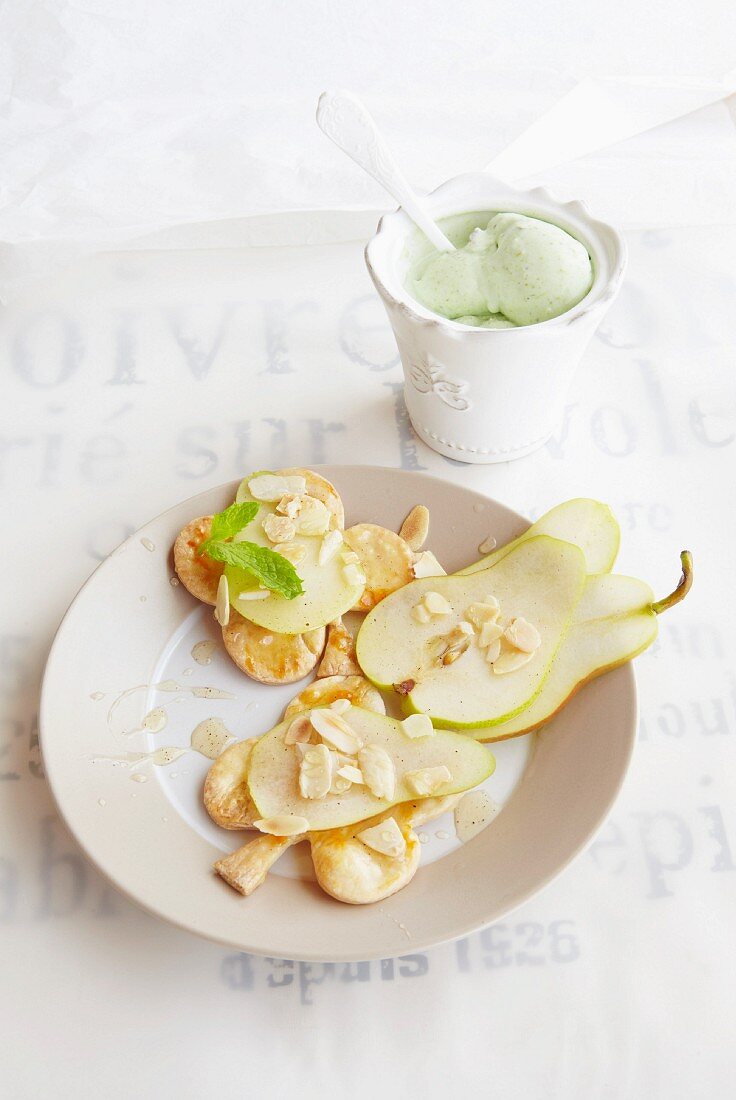 Vanilla pears with puff pastry biscuits and pistachio ice cream