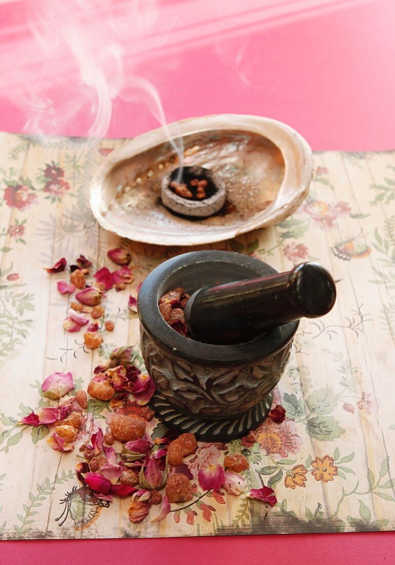 Dried rose petals in a smoking dish