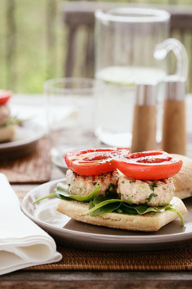 Chicken burger with fried tomatoes