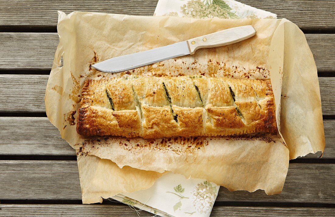 Spinach strudel on a piece of baking paper