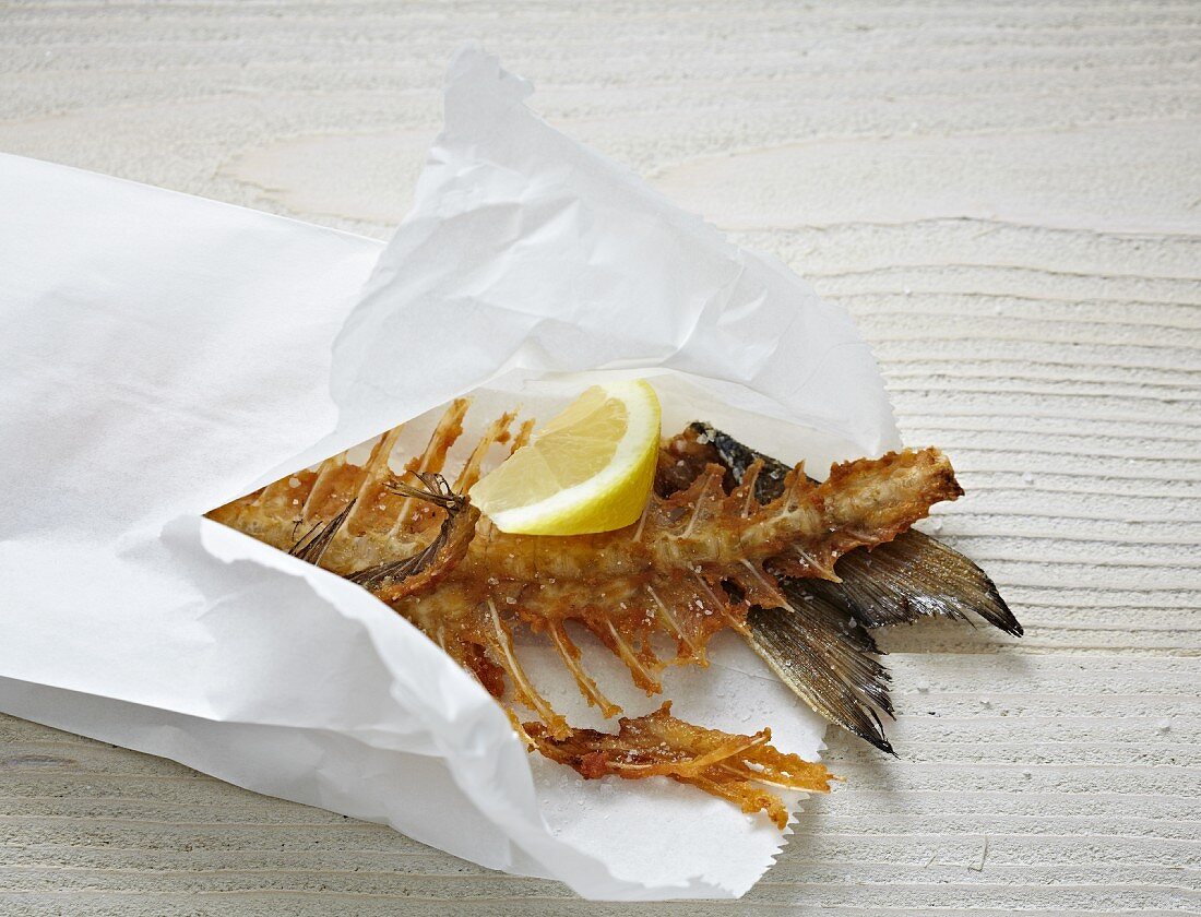 Fried fish bones in a paper bag