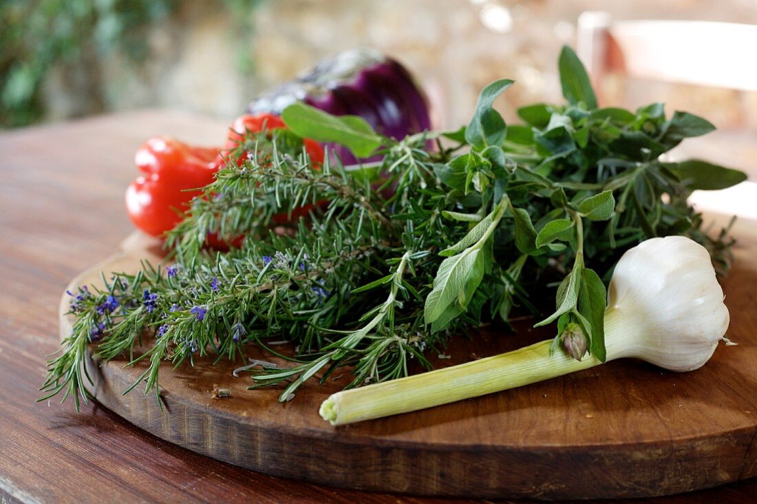An arrangement of herbs, garlic and vegetables