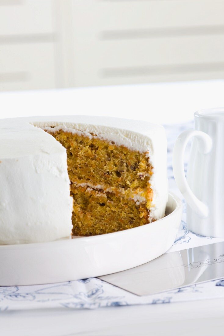 Carrot cake decorated with cream cheese