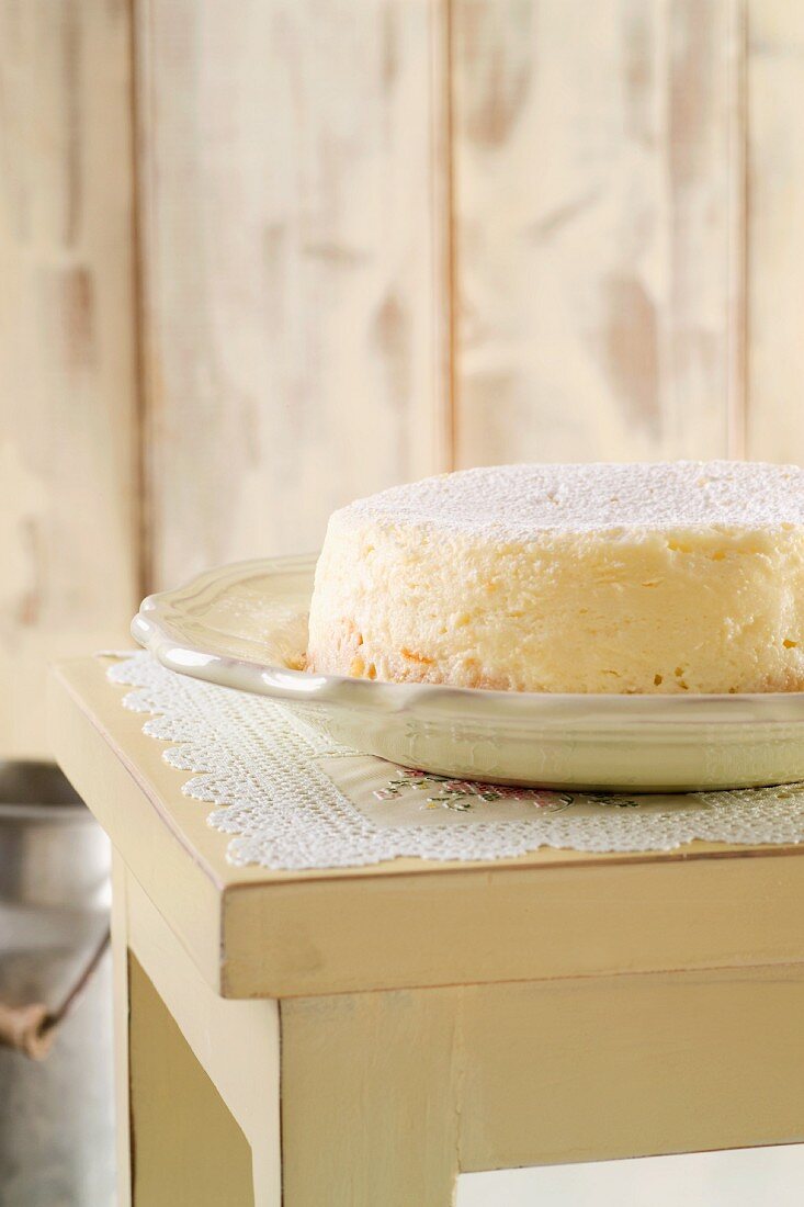 A cheese cake on a wooden table