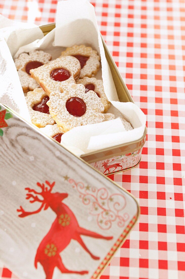 Jam biscuits in a Christmas biscuit tin