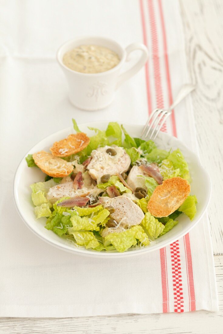 Caesar salad with chicken, capers and anchovies