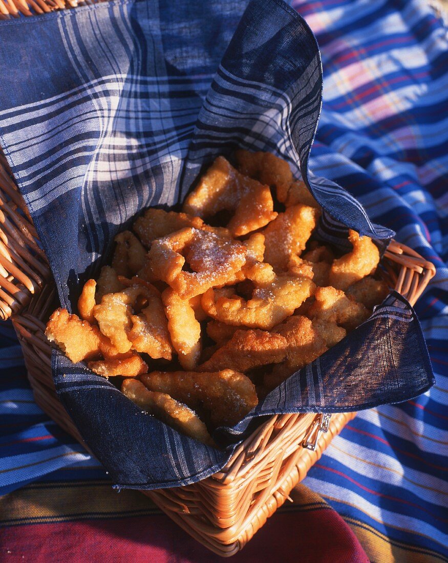 Apple beignets in a basket for a picnic
