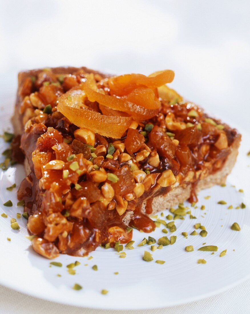 A tart made with dried fruit, nuts and caramel