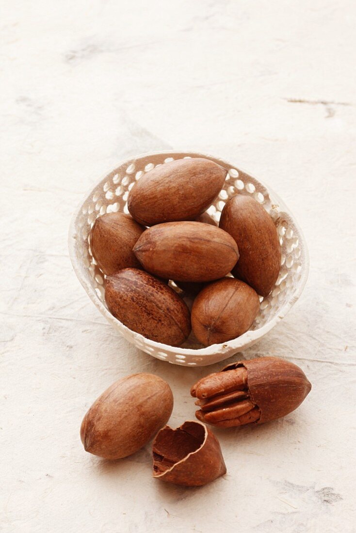 A bowl of pecan nuts