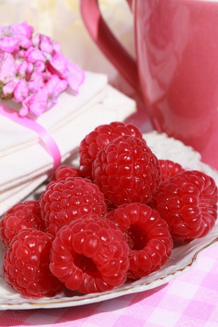 A plate of fresh raspberries