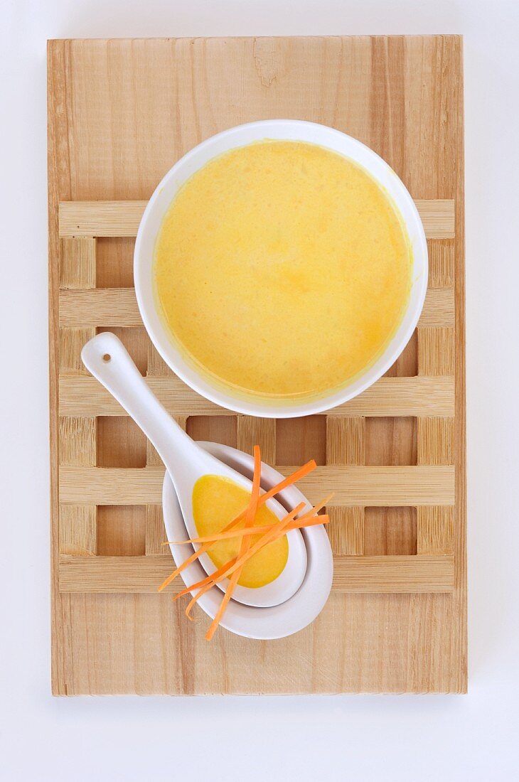 Carrot soup with carrot strips in an Oriental bowl