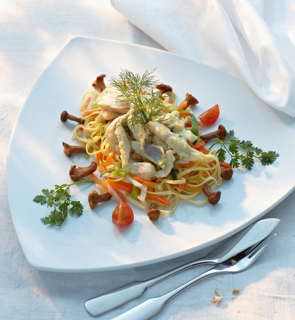 Baked trout with vegetable pasta and chanterelle mushrooms