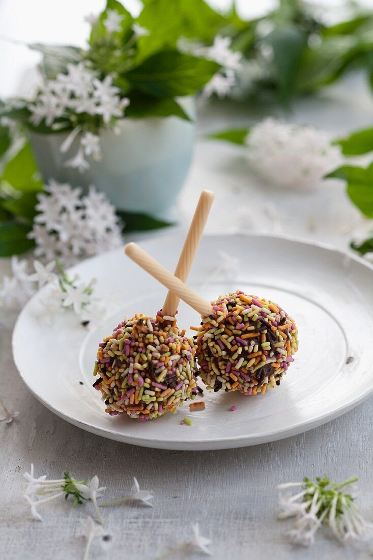 Pop cakes with coloured sprinkles