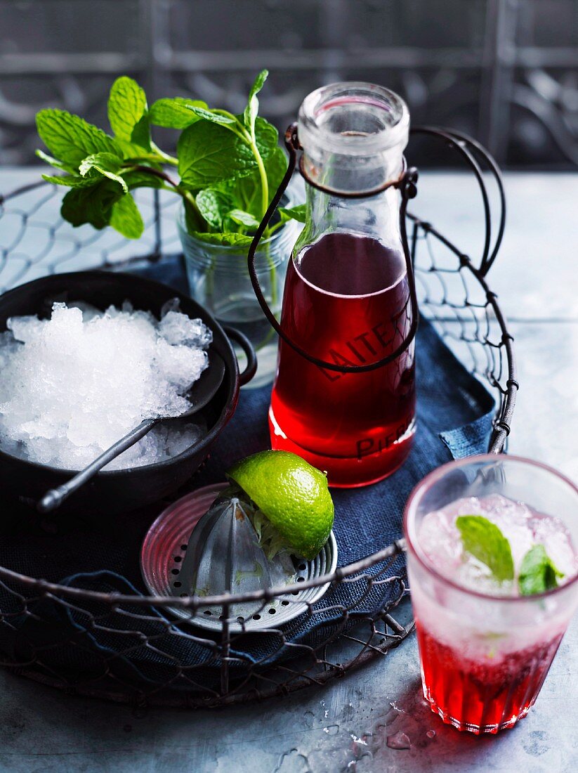 A strawberry drink with crushed ice and mint