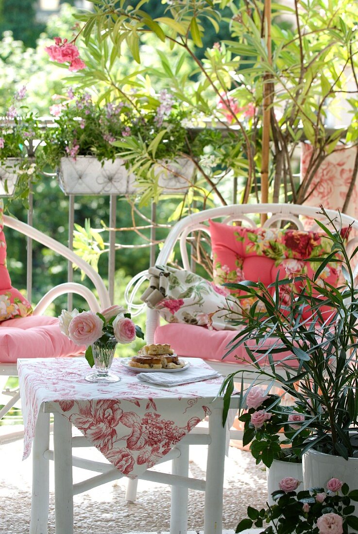 Wicker armchairs and bamboo table on balcony