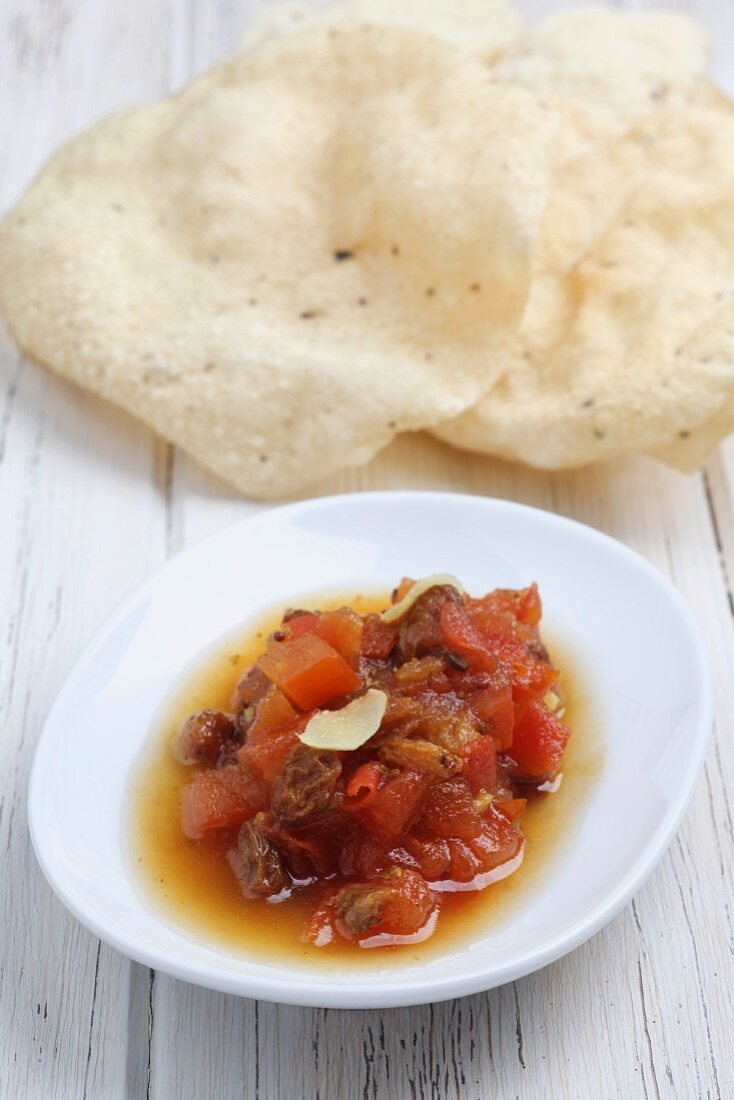 Tomato chutney and poppadoms (India)