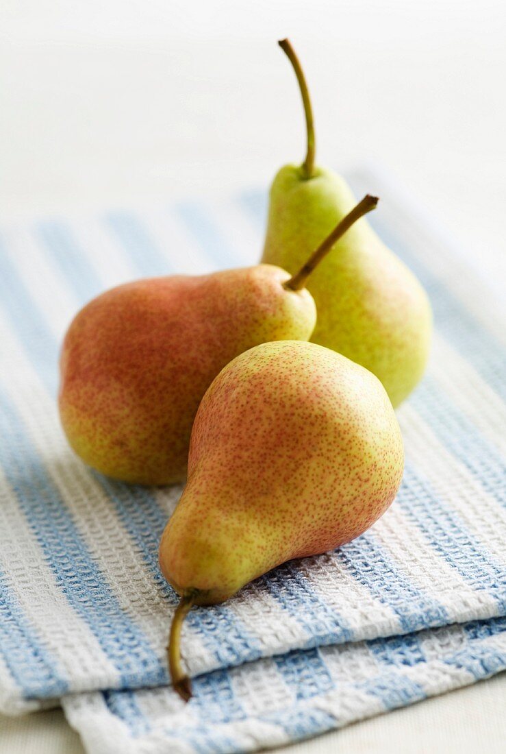 Three pears on a tea towel