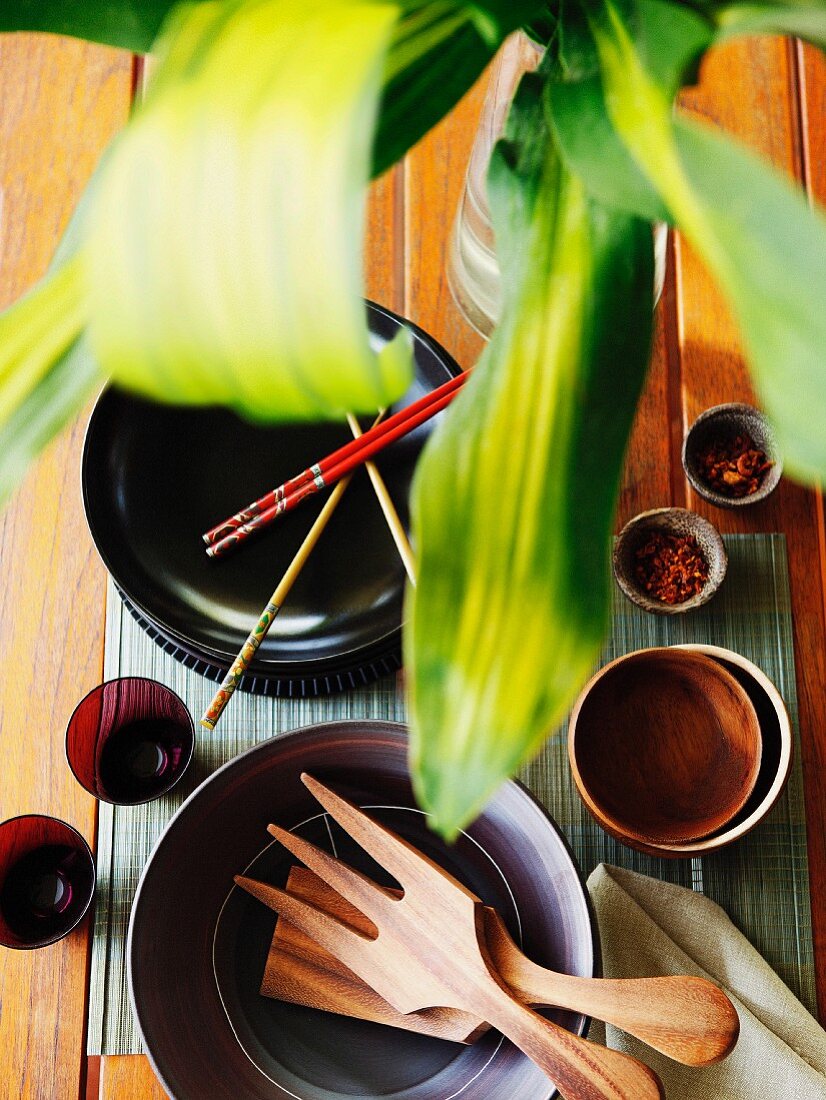 A table laid with edible bowls, chopsticks and spices (Malaysia)