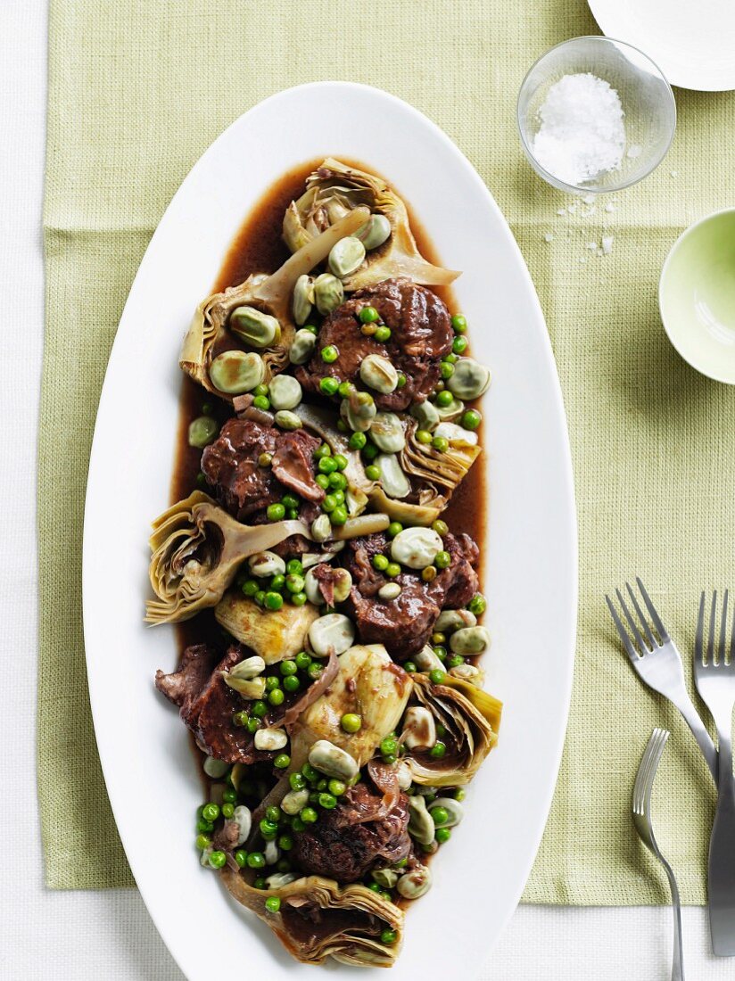 Lamb neck with artichokes, broad beans and peas