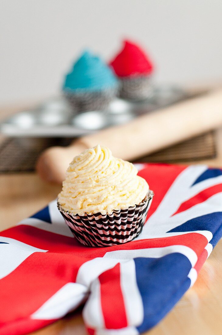 A vanilla cupcake on a Union Jack