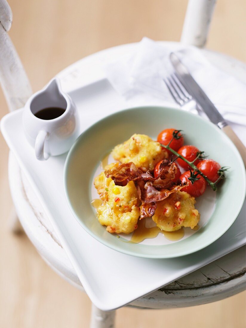 Potato cakes with bacon and tomatoes