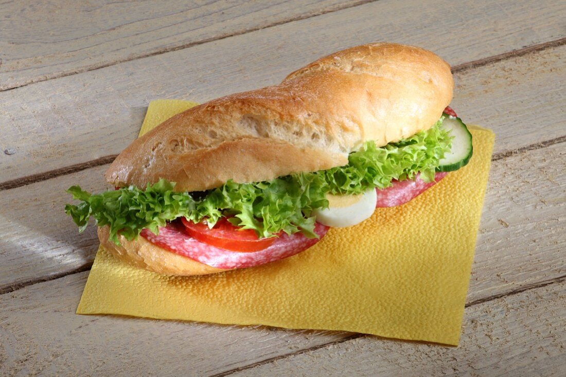 A baguette sandwich with salami