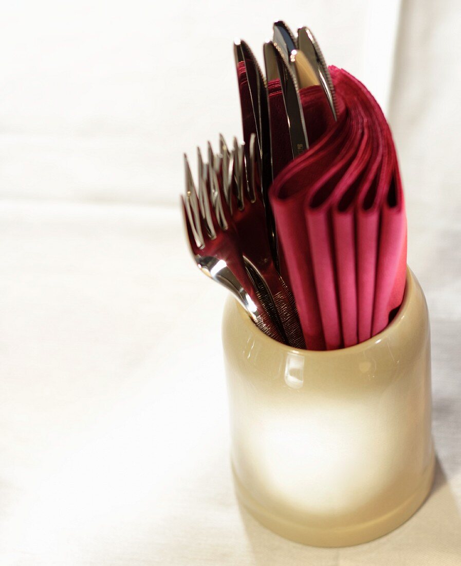 Cutlery and napkins in a jug