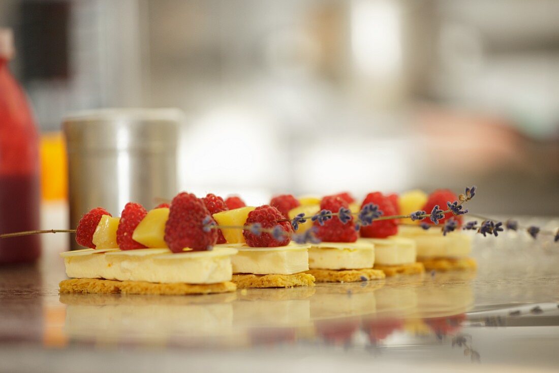 Cream slices topped with fruit kebabs