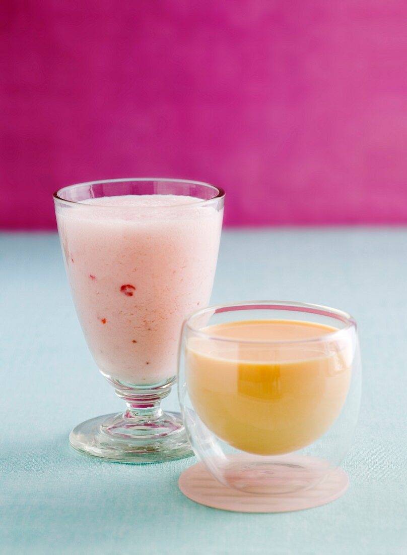 A strawberry smoothie and a mango lassi