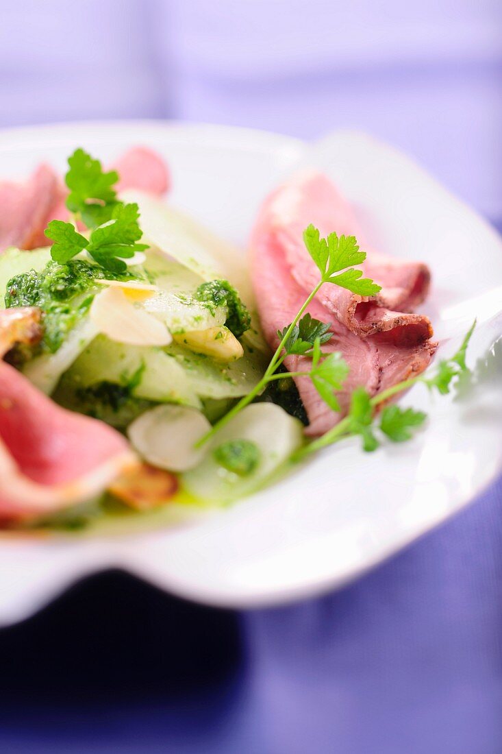 Roast beef on a radish salad with parsley pesto