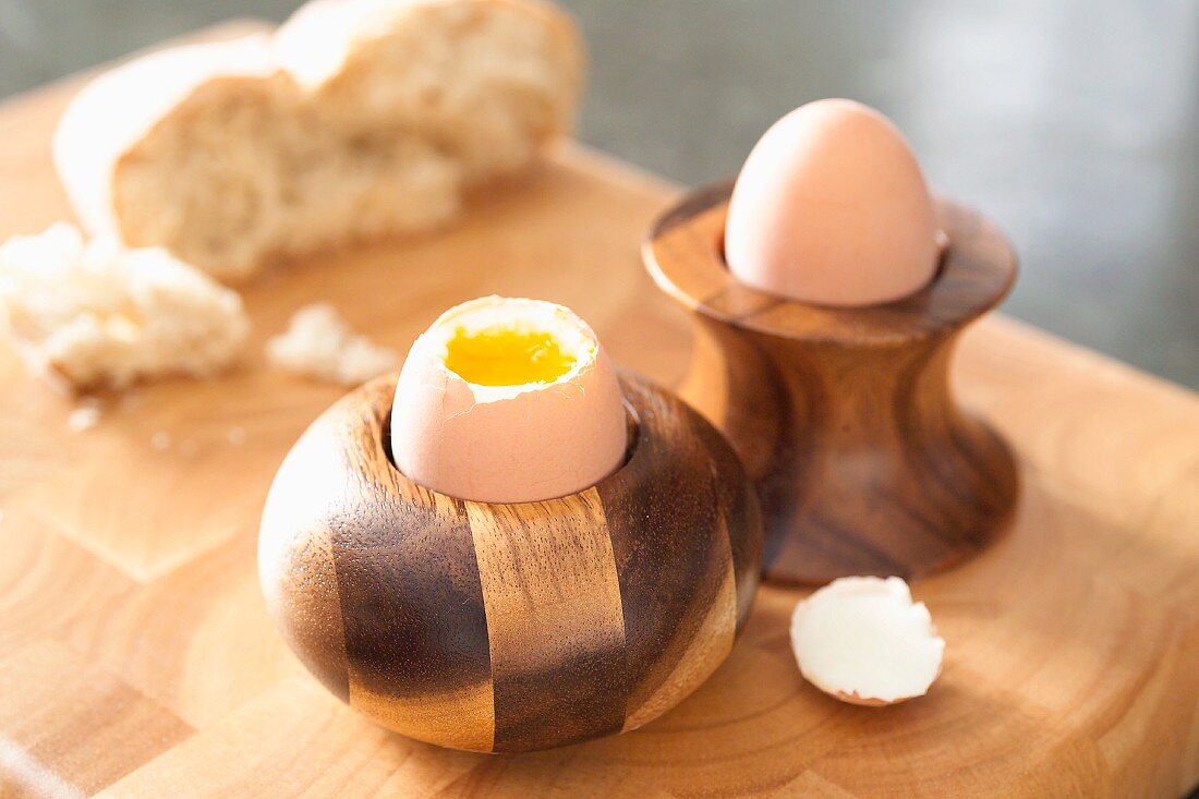 Soft-boiled eggs in wooden egg cups