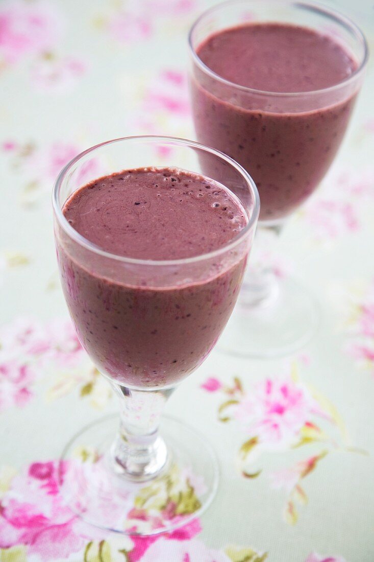 Two Antioxidant Rich Smoothies in Stem Glasses