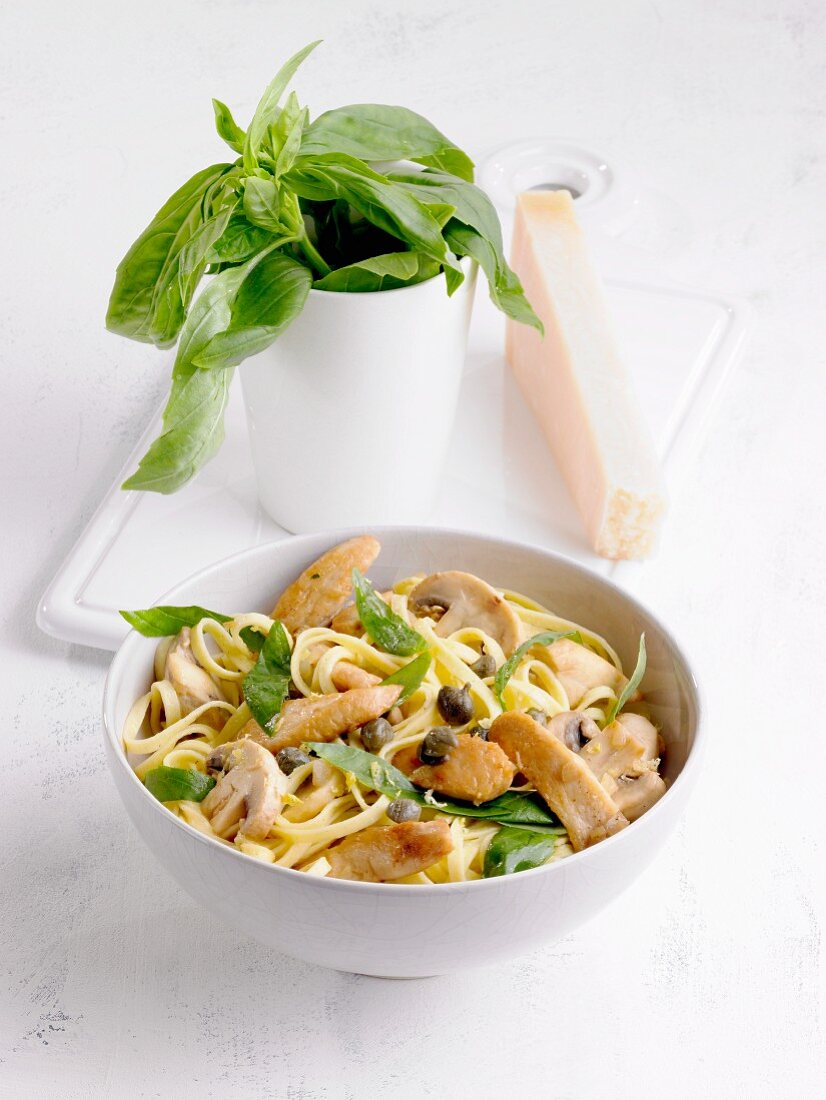Tagliatelle with lemon chicken, mushrooms, capers and basil