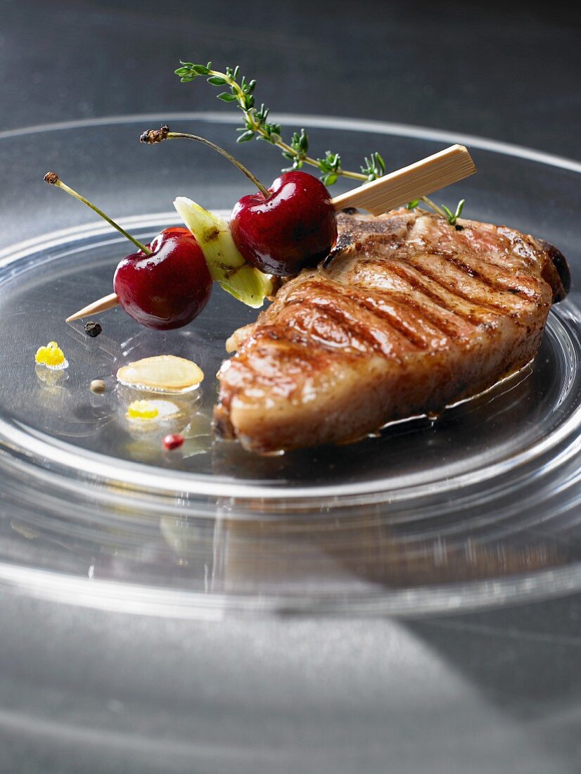 Grilled veal steak with cherries