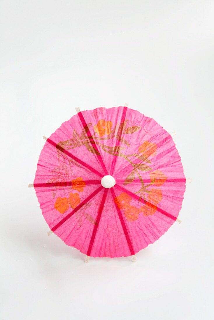 A pink cocktail umbrella