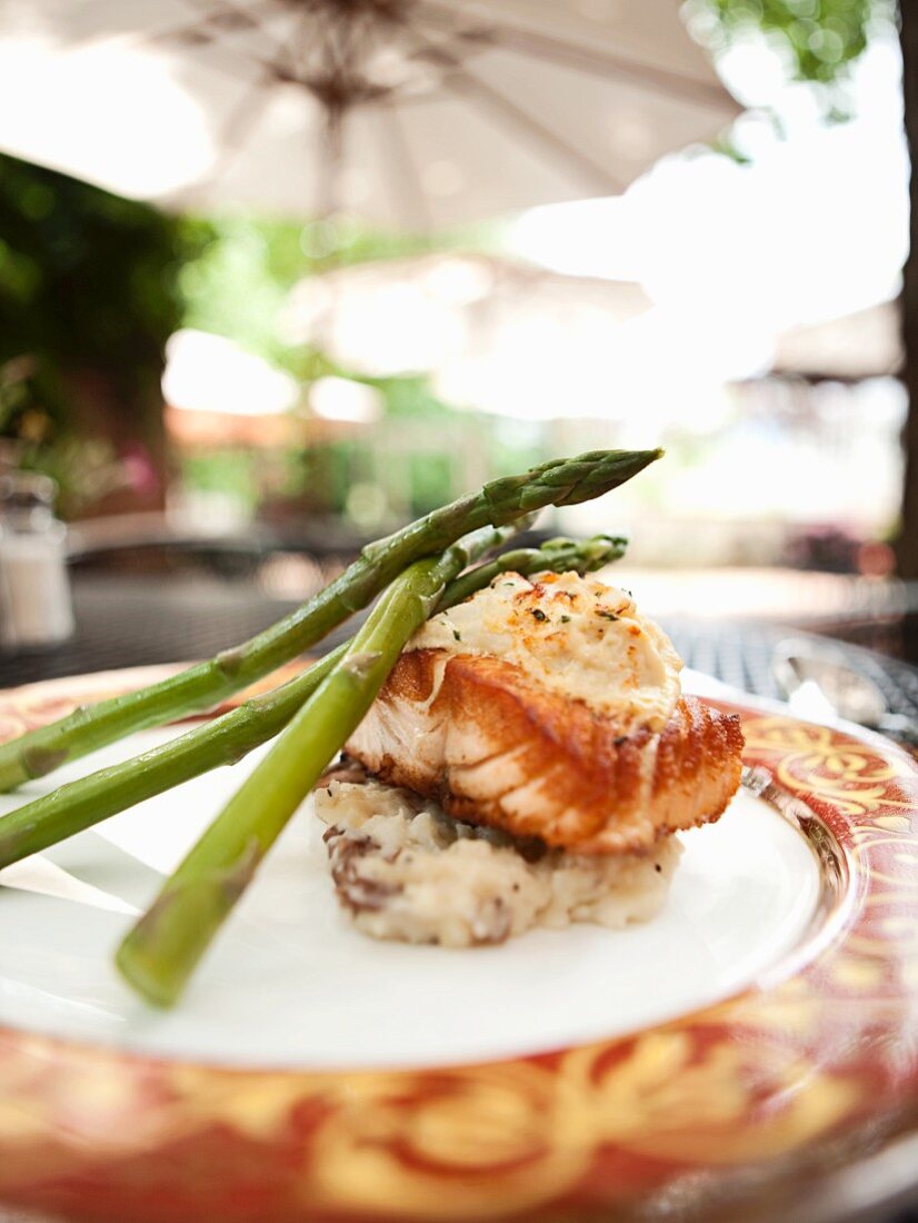Pan Seared Salmon Topped with Crab Imperial Over Red Skinned Mashed Potatoes and Asparagus