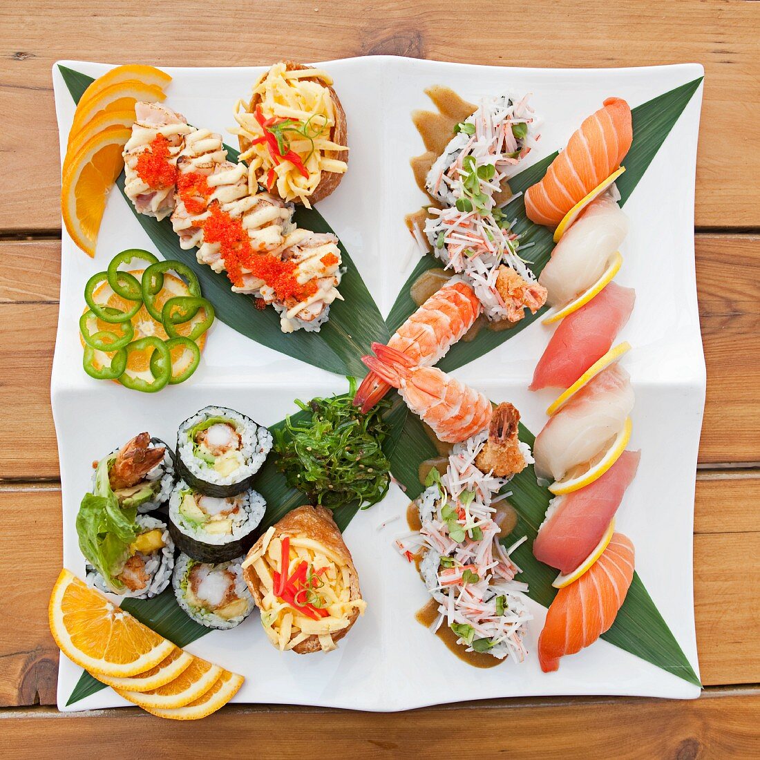 Sushi and Sashimi Sampler Platter; Tuna, Whitefish, Salmon, Shrimp, Tempura Shrimp and Avocado Rolls Wrapped in Seaweed
