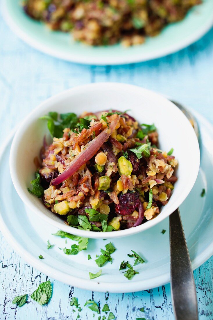 A red rice dish with lentils