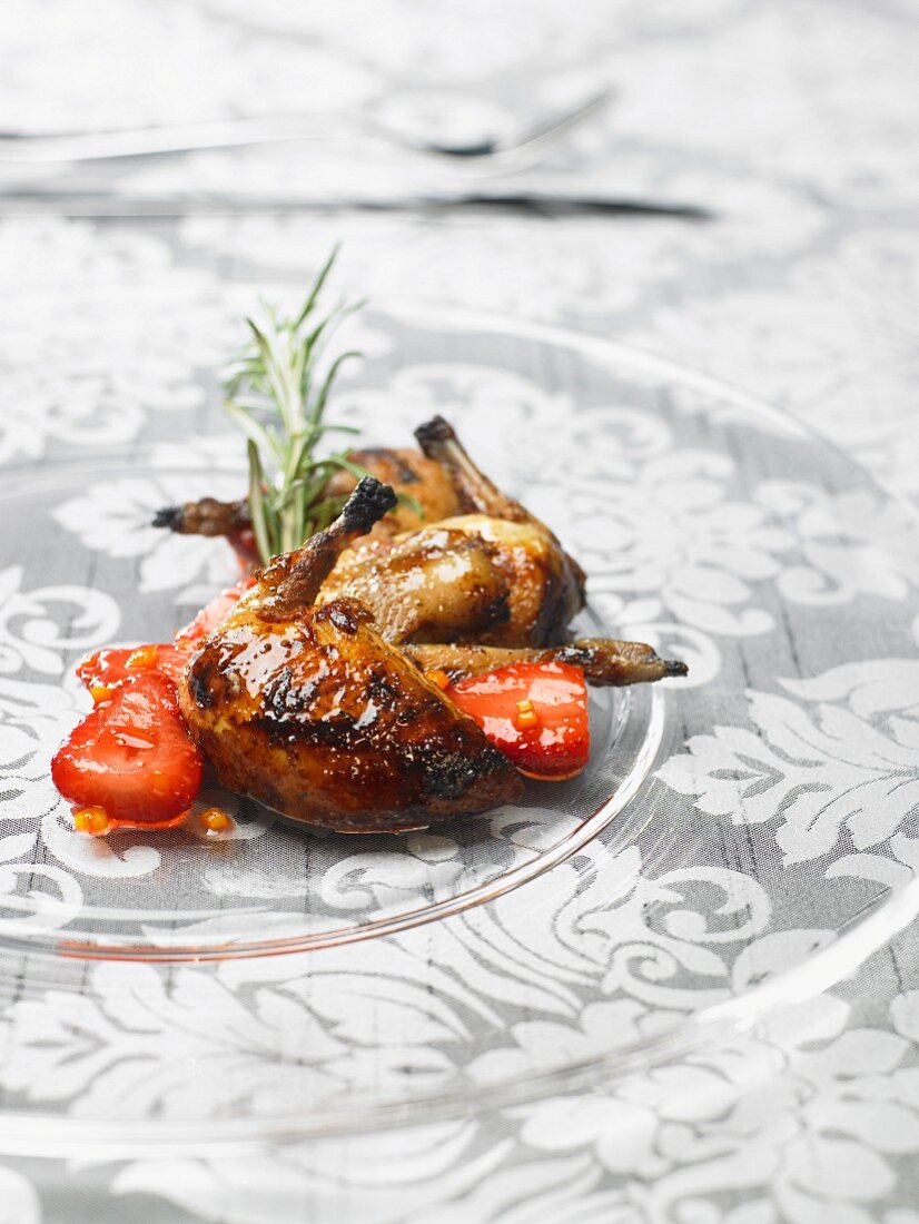 Roasted quail with strawberries and rosemary