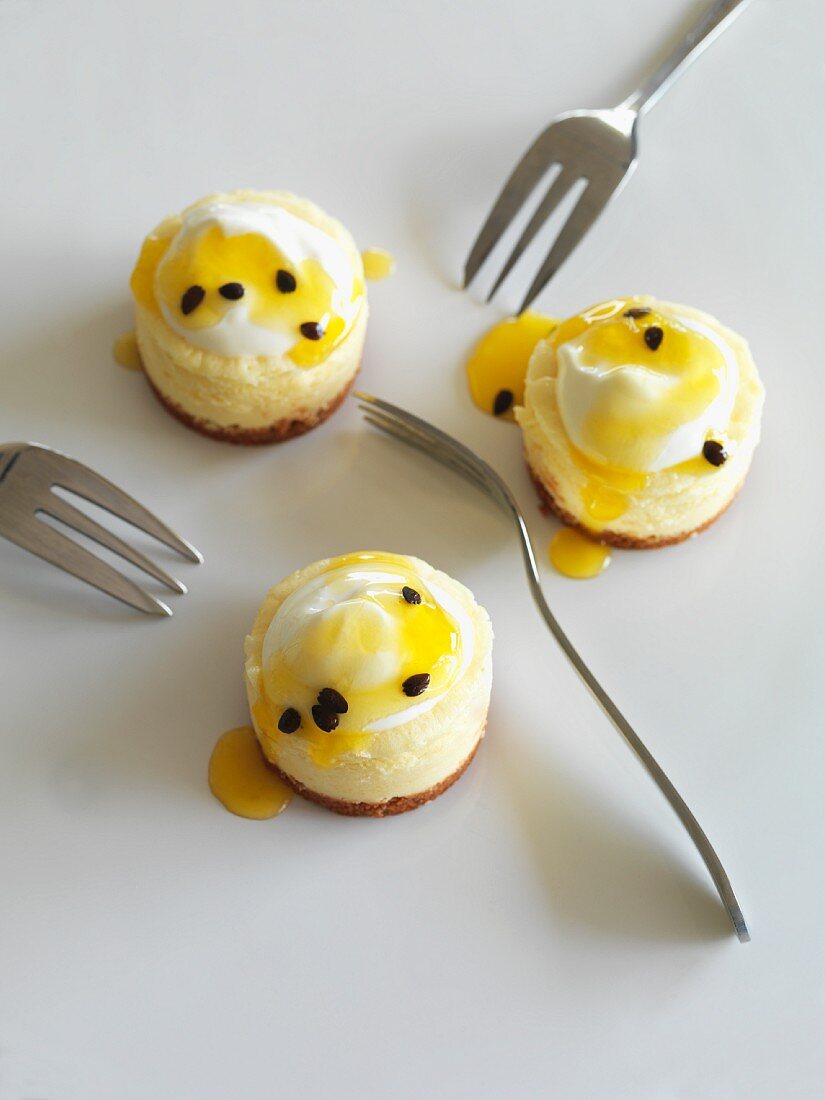 Mini cheesecakes with passion fruit sauce