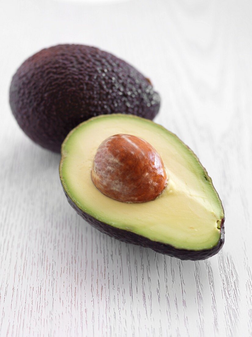 Avocados, whole and halved