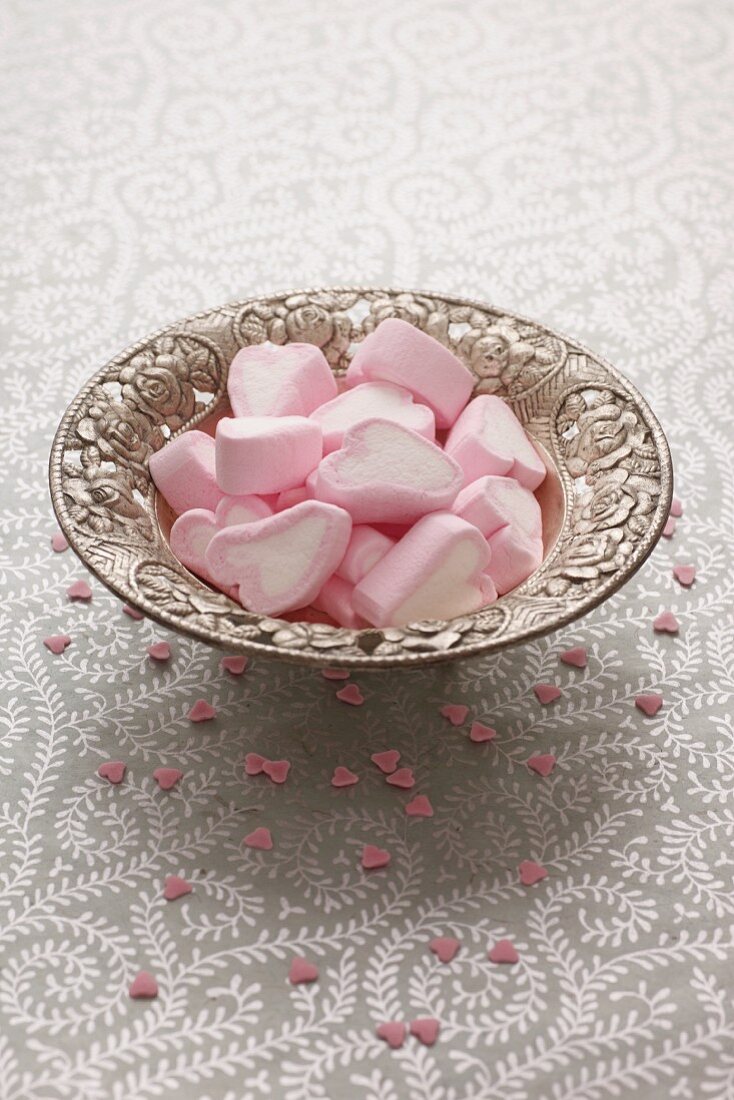 Heart-shaped marshmallows in a silver dish