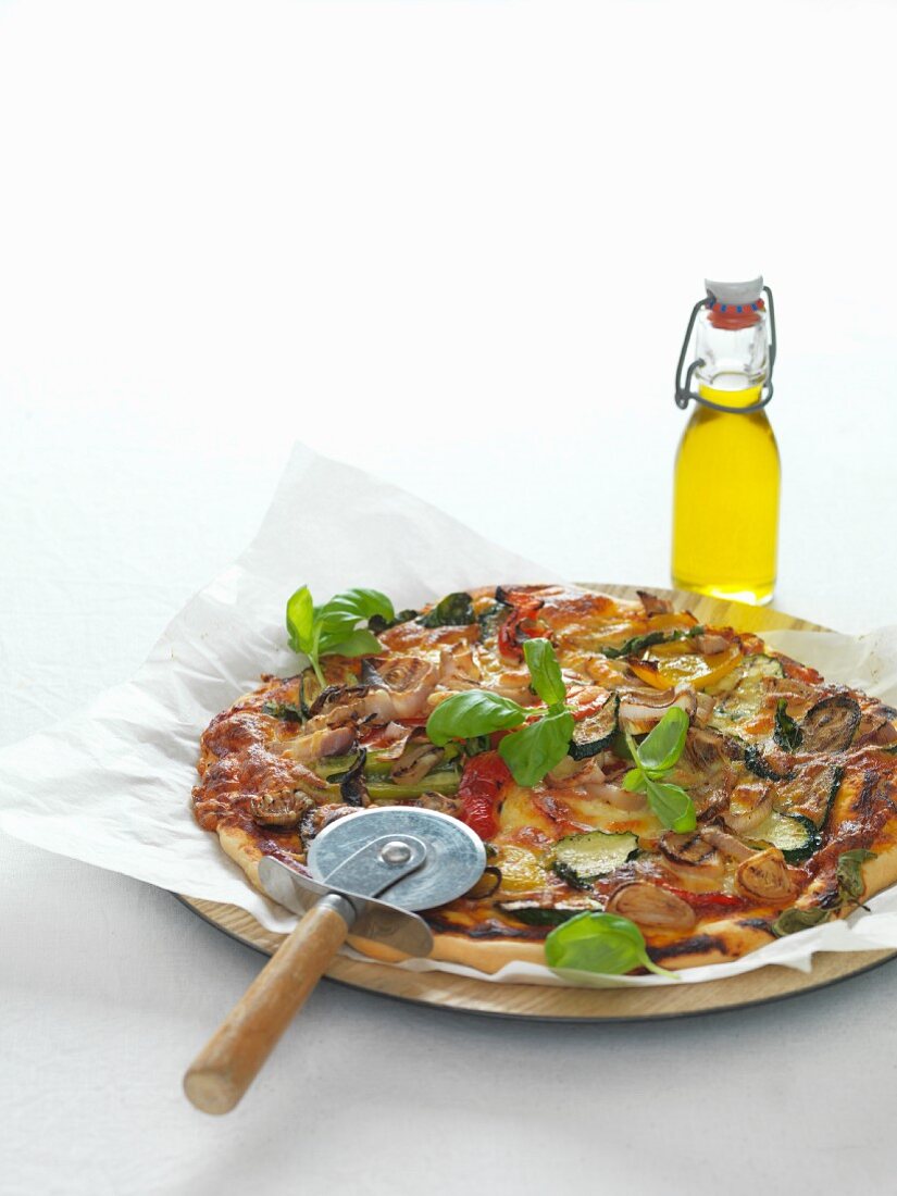 A grilled vegetable pizza and onions