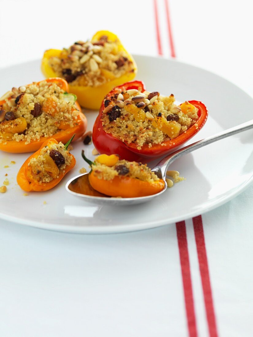 Peppers filled with couscous, pine nuts and raisins